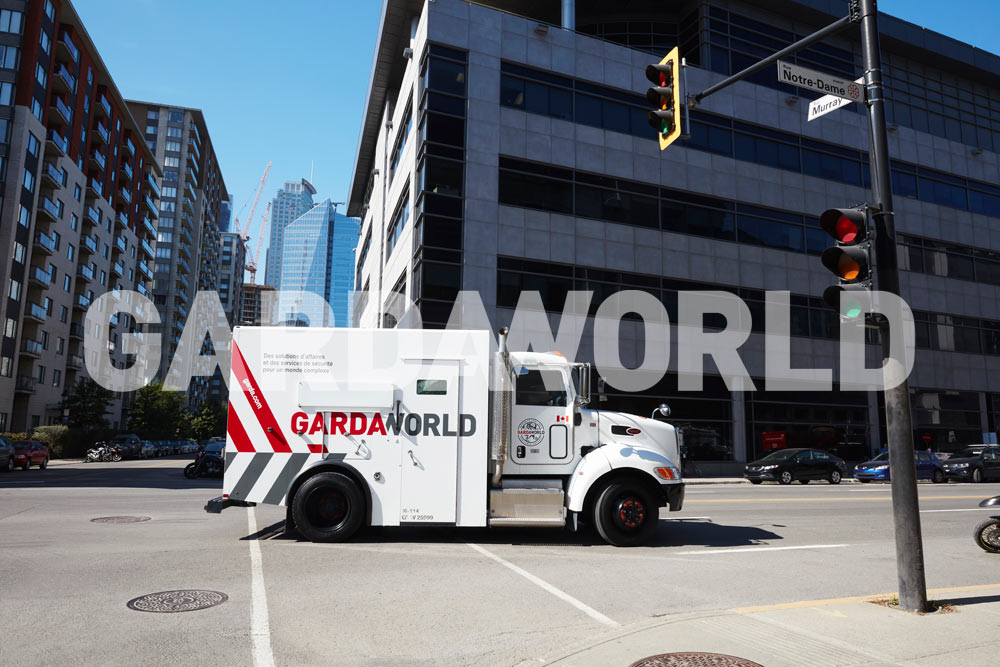 Cash Services - GardaWorld’s French Inscription on Armored Truck on the move