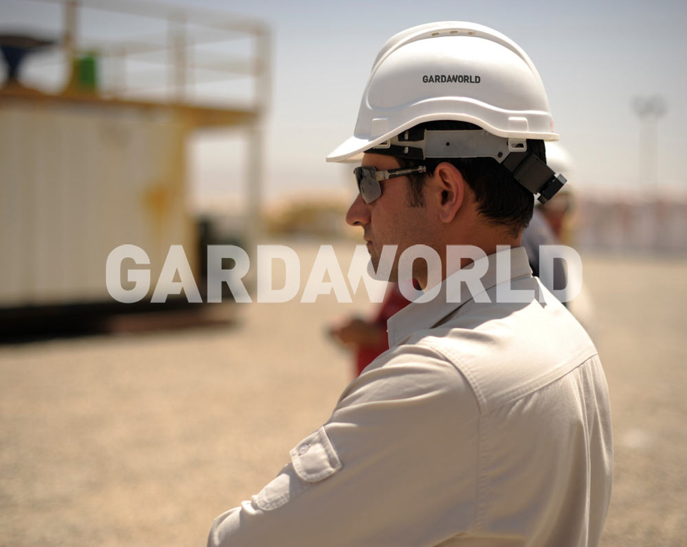 MEA Security Services Agent on field with GardaWorld hard hat
