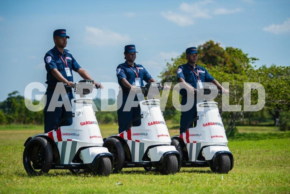 MEA Security Services, GardaWorld Officers showcasing Mobile Fleet while wearing uniform outside (men)