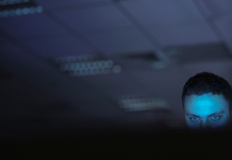 Hacker in a dark office
